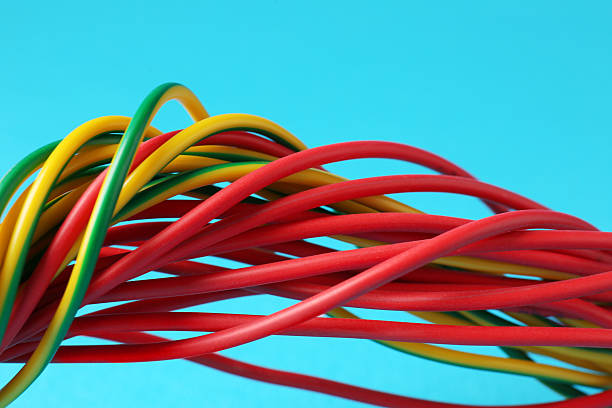 istock Many color electrical wires on light blue background, closeup 2213221761