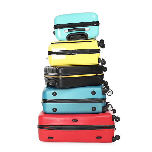 istock Stack of colorful suitcases isolated on white 2213223315