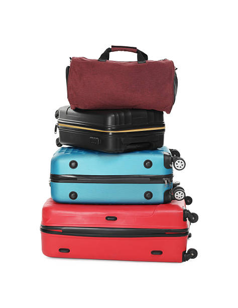 istock Stack of colorful suitcases and bag isolated on white 2213223364