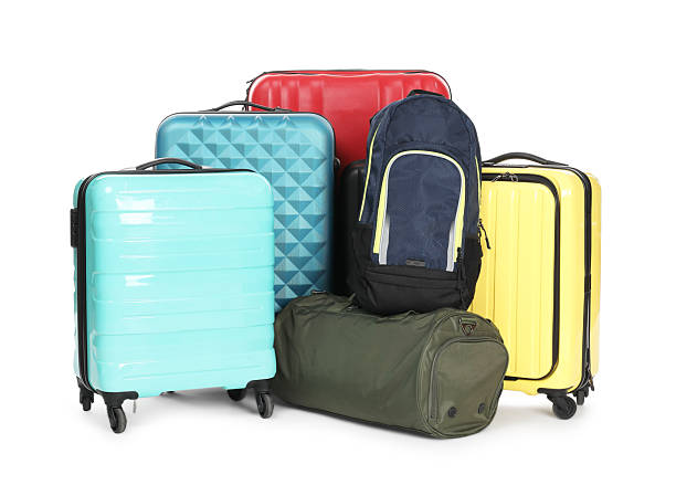 istock Colorful suitcases, bag and backpack isolated on white 2213223408