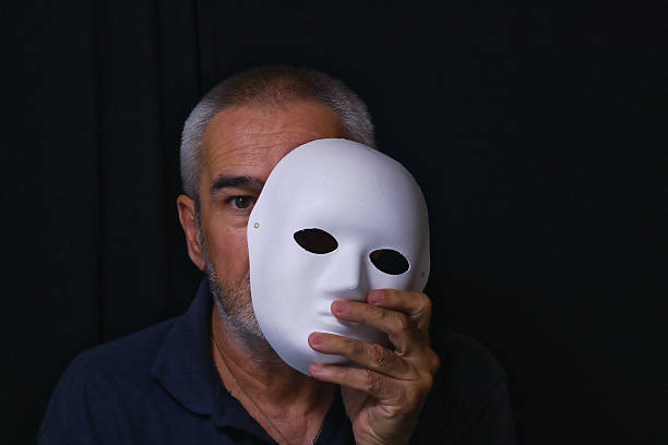 Like everyone else, he has a mask on so they can't see into his soul.