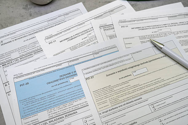 istock PIT-36 PIT-37 PIT-38 Annual tax return polish pit forms with pen on table 2213230292