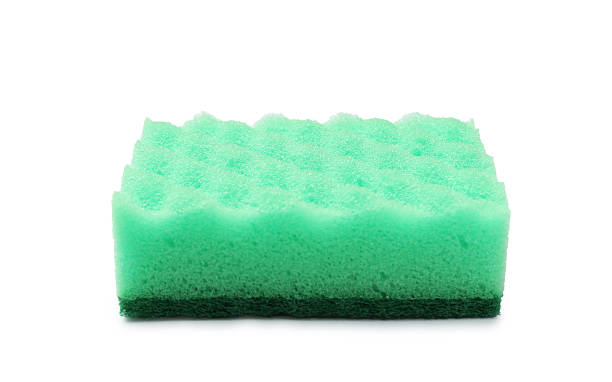 istock One green sponge isolated on white. Cleaning tool 2213230578