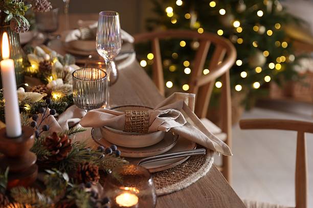 istock Christmas place setting with festive decor on wooden table in room 2213231942