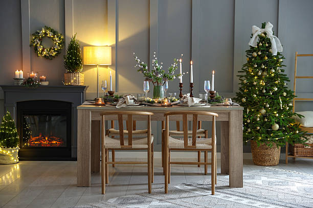 istock Christmas table setting with stylish dishware, glasses and burning candles in festive decorated room 2213231980