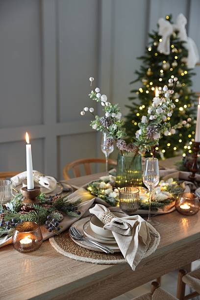 istock Christmas place setting with festive decor on wooden table in room 2213231983