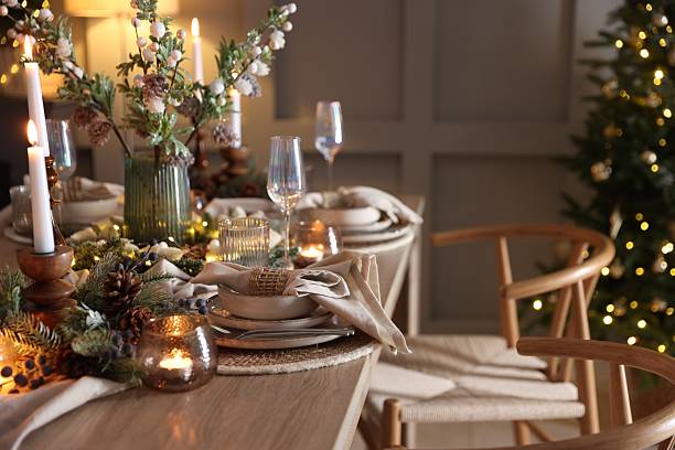 istock Christmas celebration. Festive table setting with dishware, glasses and decor in room 2213232010