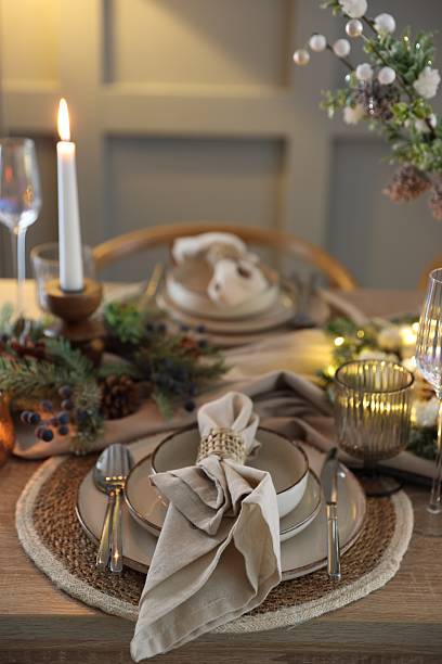 istock Christmas place setting with festive decor on wooden table in room 2213232049