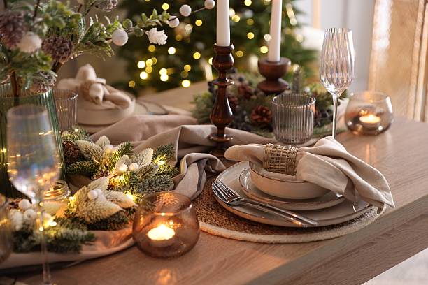 istock Christmas place setting with festive decor on wooden table in room 2213232056