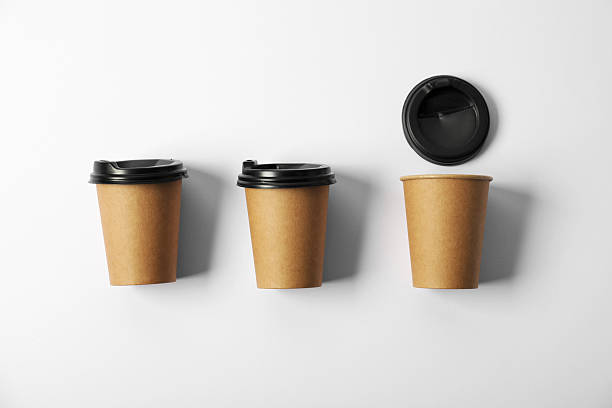 istock Paper cups with lids on white background, flat lay. Mockup for design 2213232262