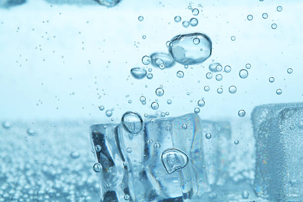 istock Refreshing soda water with ice cubes as background, closeup 2213233851