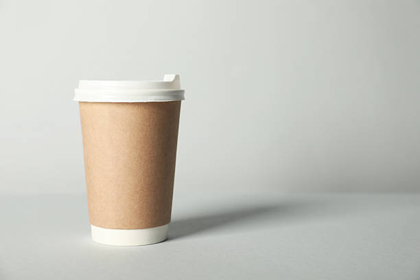 istock Paper cup with lid on grey background. Mockup for design 2213234468