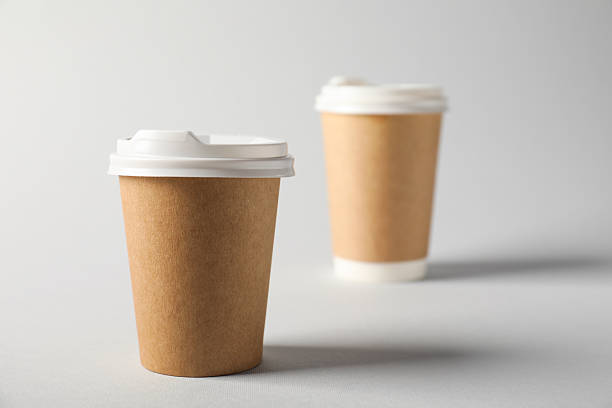 istock Paper cups with lids on grey background, selective focus. Mockup for design 2213234480