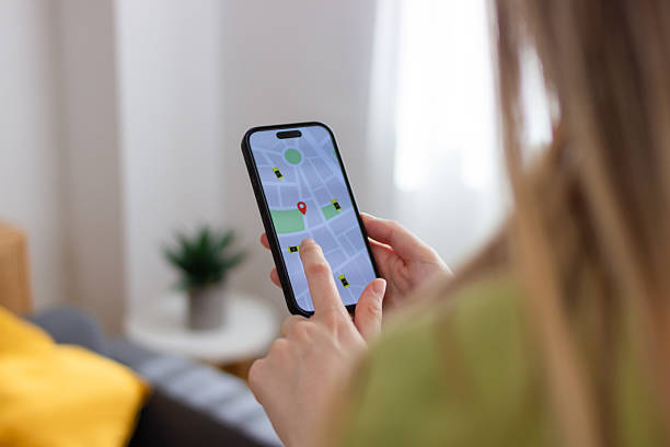 istock Woman using navigation app on smartphone to find parking spot 2213235831