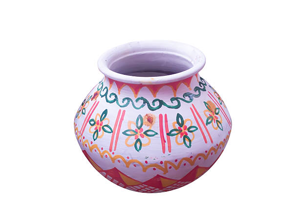 Traditional clay pot with intricate hand painted patterns, showcasing vibrant tribal art designs, isolated against a plain white backdrop.