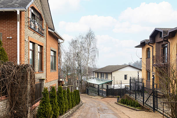 new building luxury suburban house in sunny summer afternoon. House hunting