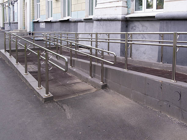 istock ramp with metal railings for disabled people, copy space 2213240547