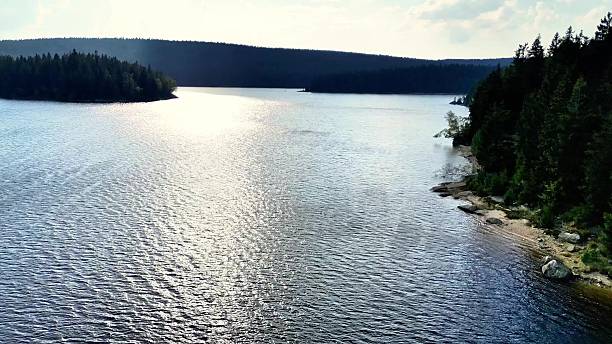 istock A Serene Lake Surrounded by a Lush Green Forest Landscape That Beckons Exploration 2213242316
