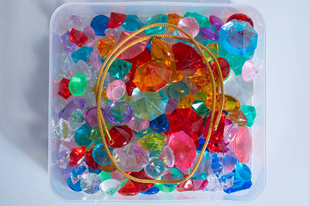 Collection of colorful plastic rings on white background. Selective focus.