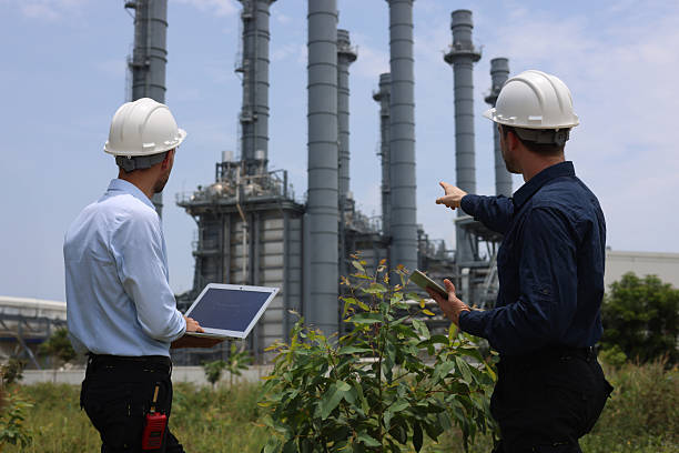 istock Two male engineers are discussing an ESG environment project, zero carbon at a thermal power plant 2213245791