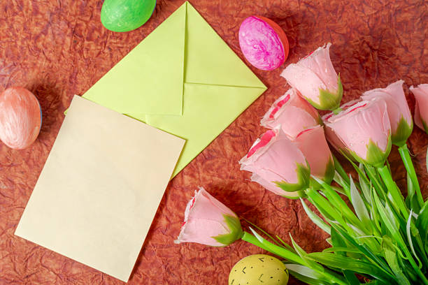 istock Colorful arrangement with pastel roses, Easter eggs and stationery. 2213246141
