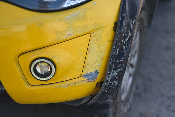 istock Yellow bumper car scratched with deep damage to the paint. 2213248338
