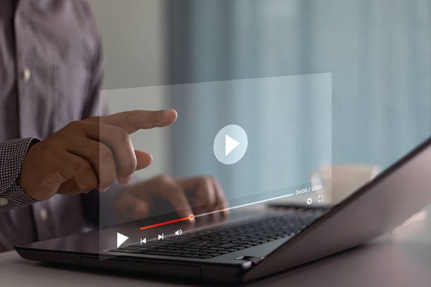 istock Video streaming on internet. Concept about subscription based live digital stream. Man hands using laptop computer for streaming and watching online movie, TV series, live concert, show or tutorial. 2213251052