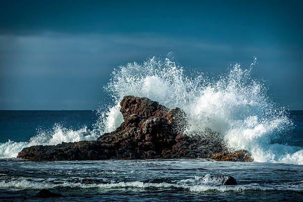 Wave crashing, big spray, white water, Big Island of Hawaii, mid-morning on the west coast of the island.