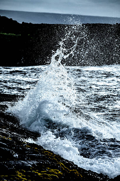 istock Wave Crashing Against Lava Rock 5 2213255987
