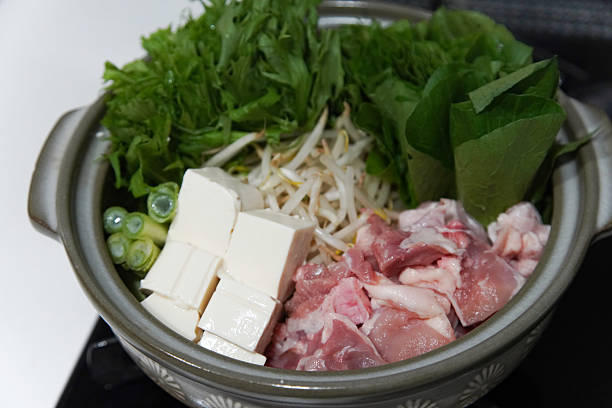 istock Making chicken and chrysanthemum hotpot 2213258575
