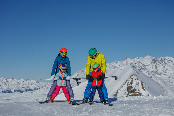 istock Family enjoys skiing together in a beautiful mountain setting 2213261455