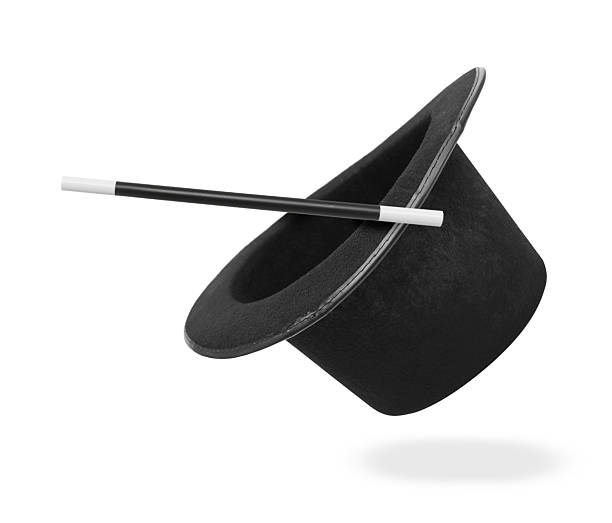 istock Magic wand and top hat isolated on white. Magician trick 2213273815