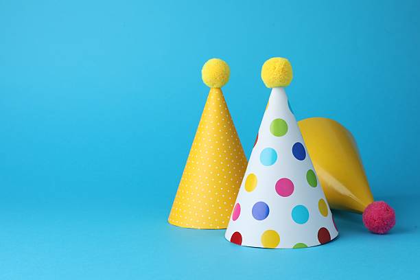 istock Colorful party hats on light blue background, space for text 2213273870