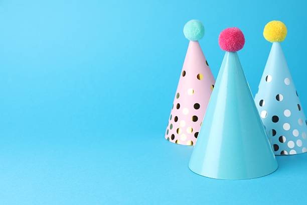 istock Colorful party hats on light blue background, space for text 2213273876