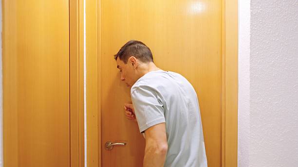 istock Impatient man waiting for occupied bathroom at home 2213290289