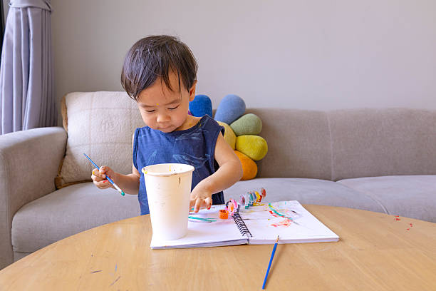 istock Baby drawing in living room 2213291574