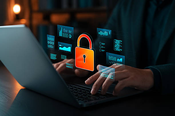 istock Cybersecurity concept showing hands typing on laptop with virtual lock icon and data interface. Symbol of data protection, privacy, network security, and digital safety technology. 2213296888