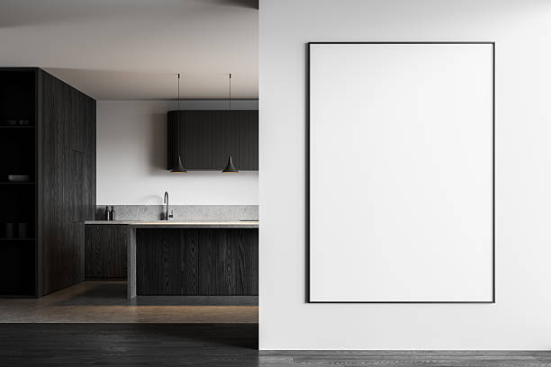 istock Minimalist modern kitchen interior with large vertical blank poster mockup on clean white wall next to dark wood cabinet and countertop area. 3D Rendering 2213299744