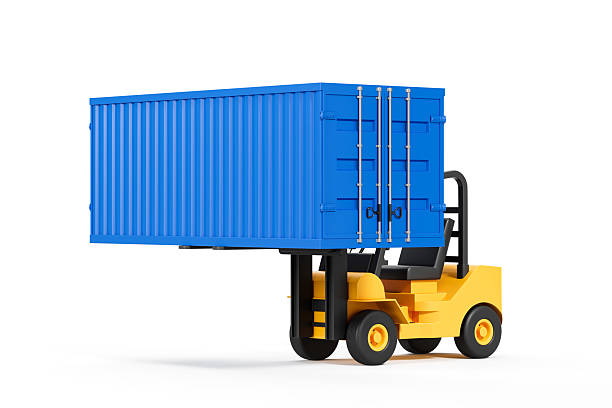 A compact forklift is parked beside a brick building. Near the vehicle, there are stacked metal pipes and construction materials, indicating ongoing work in the area.