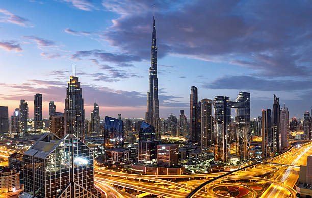 istock Fantastic rooftop view of Dubai's modern architecture by night with illuminated skyscrapers, UAE 2213301235