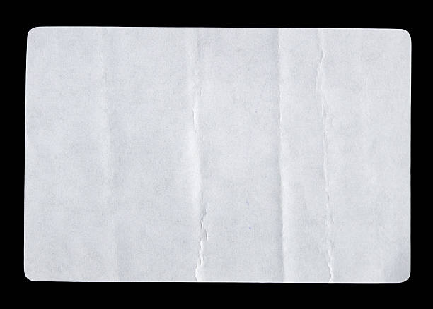 istock White adhesive glued paper sticker label isolated on black background 2213304112