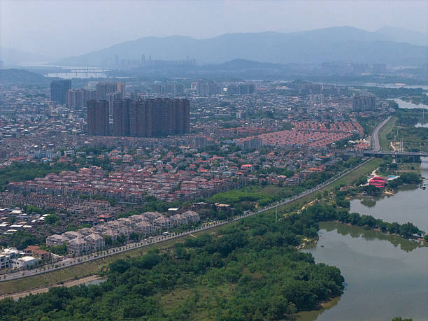 istock Urban Landscape with Greenery and Waterway 2213305426