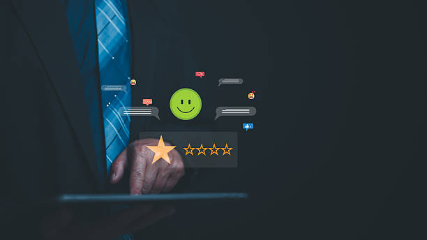 istock Customer Centric Digital Experience Man In Suit Reviews Customer Feedback On Tablet, Showcasing Satisfaction Through Star Rating, Happy Face Emoji, Social Media Reactions, And Email Integration 2213310975