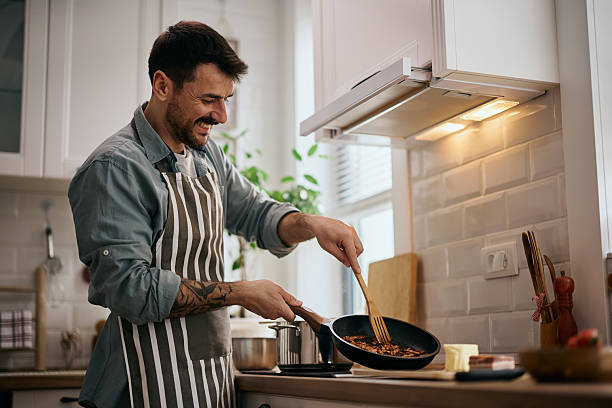 istock Happy man enjoying in cooking in the kitchen. 2213312394