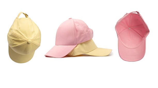 istock Pink and yellow cap isolated on white background. 2213315175