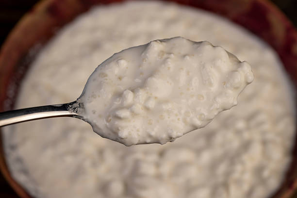 istock cottage cheese made from lumps with cream close-up 2213315580