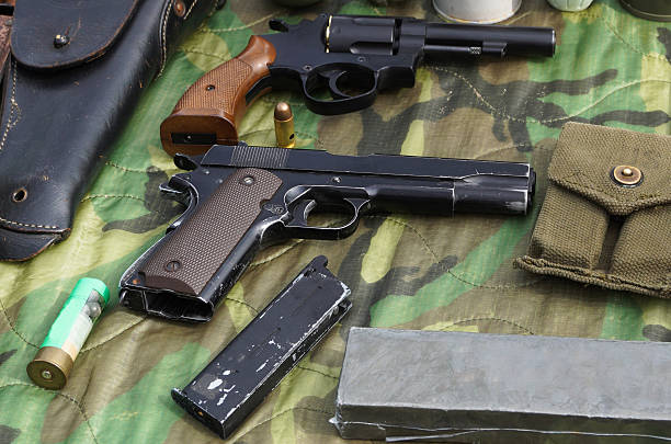 istock Old handguns on a table outdoor 2213316328