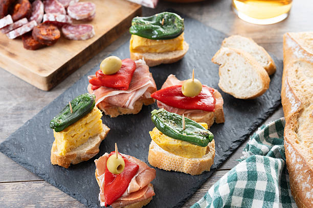 istock Traditional Spanish pintxos on wooden table 2213322077