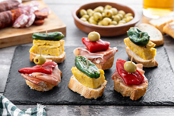 istock Traditional Spanish pintxos on wooden table 2213322090
