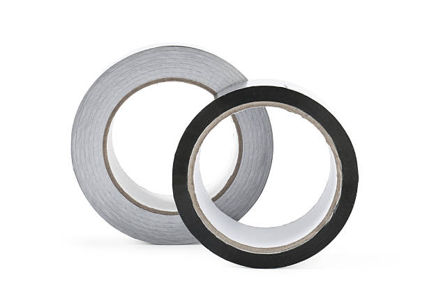 istock Rolls of silver adhesive tape isolated on white 2213322183